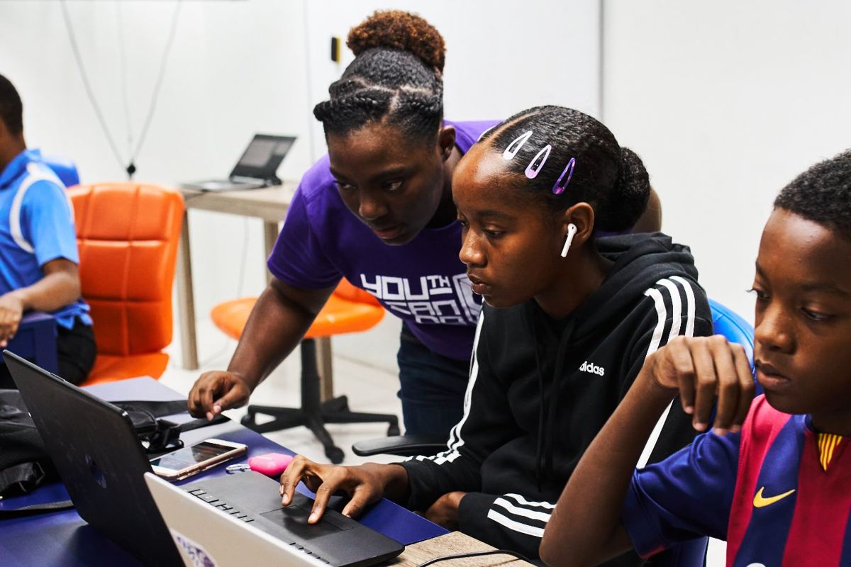 Young people using laptops at a YCDI innovation hub